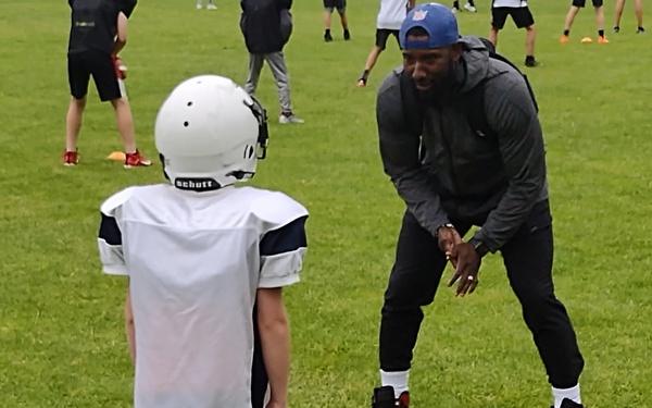 Seattle Seahawks' Lawyer Milloy, right, talks with Marcus Brown on