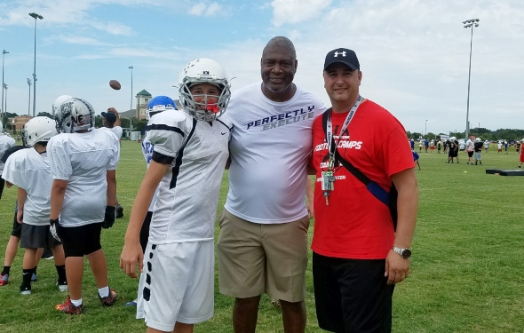 Terrance Williams, Dallas Cowboys wide receiver, coaches children during a  youth football camp June 26, 2017, at Joint Base San Antonio-Randolph.  JBSA-Randolph was one of the 11 military communities selected to host